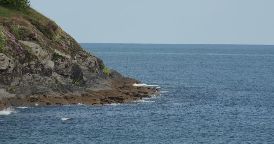 Extra wide shot of exposed rocks at low tide at west of Aberporth bay