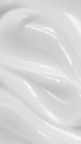 Vertical closeup white eye, skin cream texture background, facial cosmetics mask