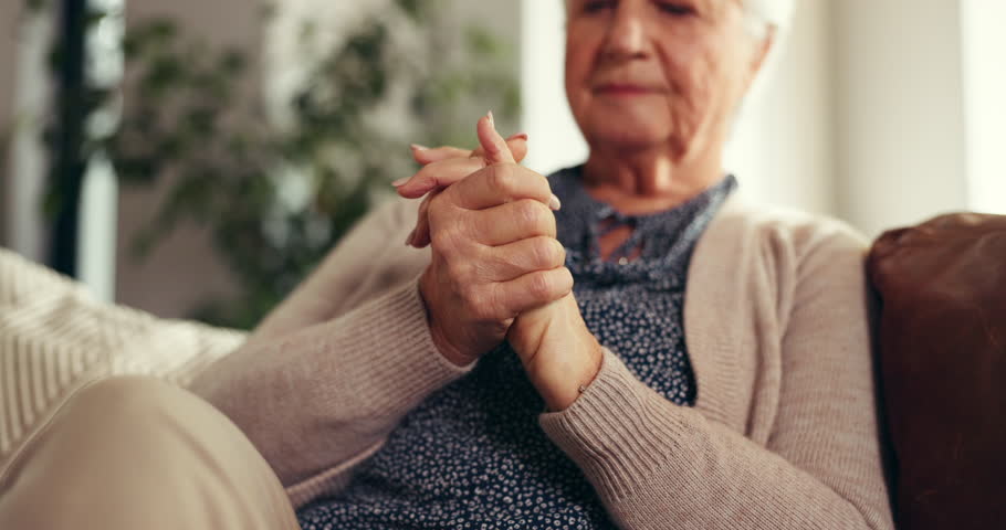 Senior woman, hands and pain with arthritis for joint inflammation or wrist injury on sofa in home. Closeup, elderly or female person with ache or strain for fibromyalgia or carpal tunnel syndrome