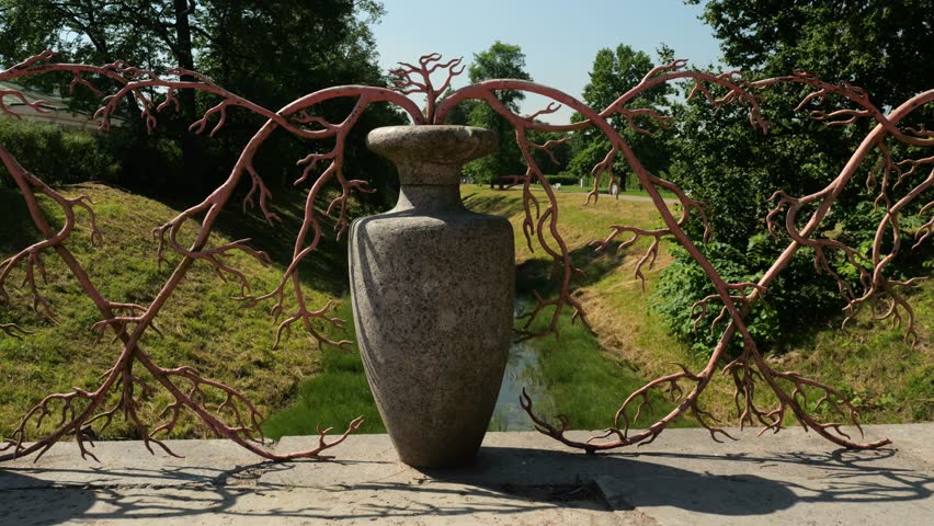 Parapet of Large Chinese bridge in the Alexander park formed by tall, elegant vases and decorative intertwined iron branches that imitate red coral, Tsarskoye Selo (Pushkin), Russia