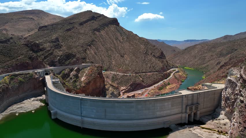Aerial view of the majestic Theodore Roosevelt Dam cutting across the Salt River, a monumental structure amidst the arid landscape, Theodore Roosevelt lake, Arizona, United States.
