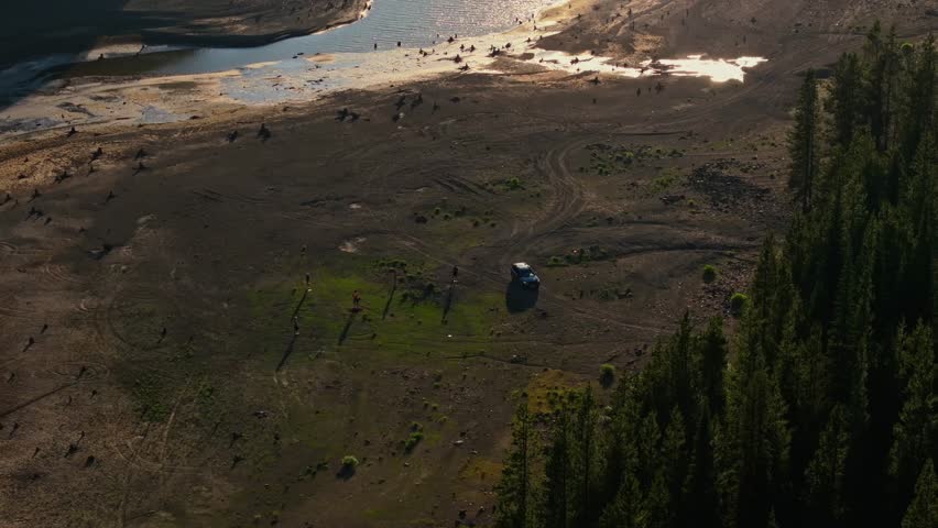 Scenic view of grassy lake near Yellowstone, calm and reflective mood