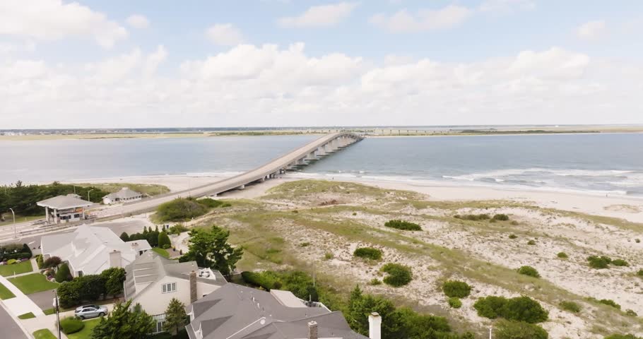 Aerial view of Ocean City New Jersey beach over the Atlantic Ocean with bridge