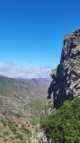 Beautiful view mountains rocks, green forest blue sky nature outdoors travel trip vacation hiking tour environment natural amazing view landscape scenery Spain Tenerife above high clouds beauty world