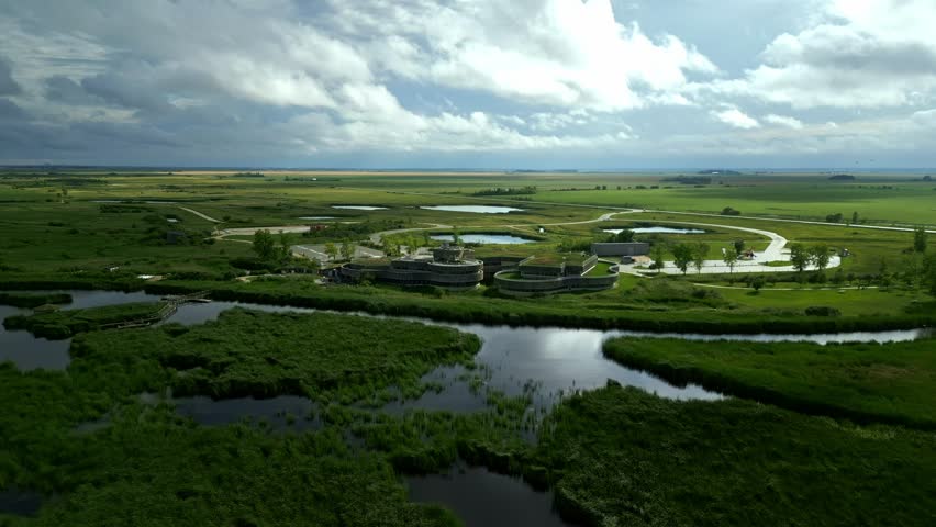 Eco centre in Canadian wetlands with sunbeams through clouds, quick establishing