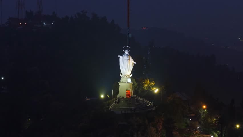 Night pan shot of the Virgin Mary statue on San Cristóbal Hill, Santiago, Chile.