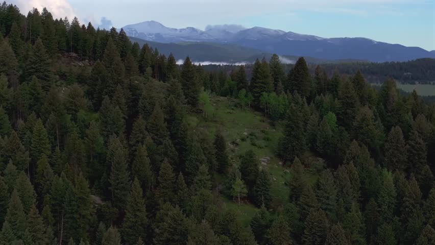 Foggy Front Range Rocky Mountains Mount Blue Sky Evans foothills valley of Evergreen Colorado aerial drone summer spring Marshdale Conifer Bailey Arapaho National Forest morning clouds forward motion
