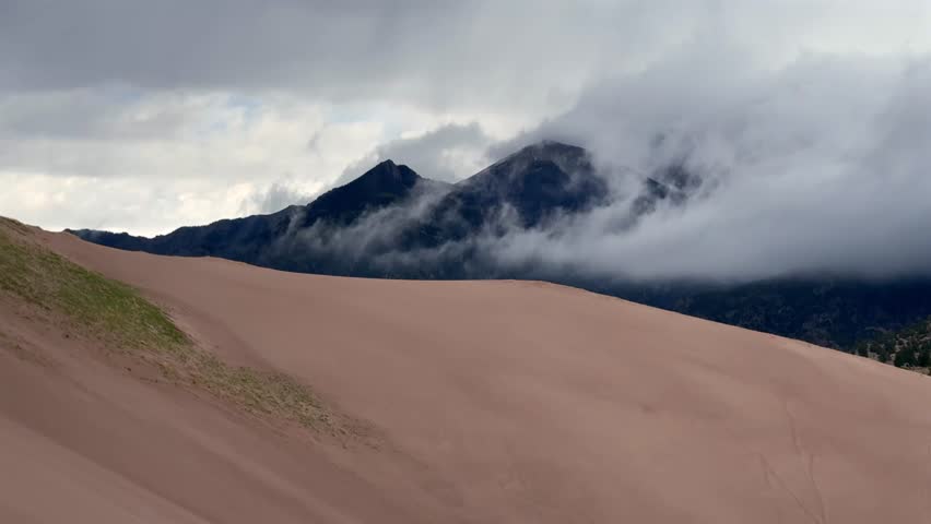 Great Sand Dunes National Park Spring summer stormy foggy cloudy raining mist Crestone Needle peak Colorado Sangre de Cristo range Rocky Mountains magical dunes of large amounts of sand hills static