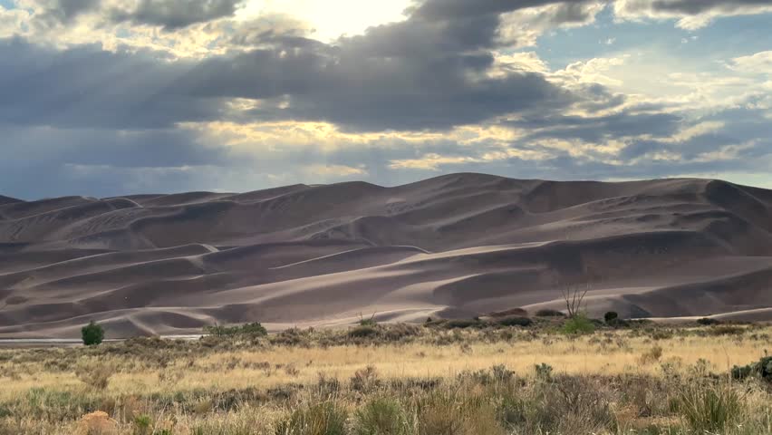 The Great Sand Dunes National Park Sangre de Cristo range Rocky Mountains spring summer raining sunny cloudy Colorado unique magical large amounts of sand dune hills windy landscape static