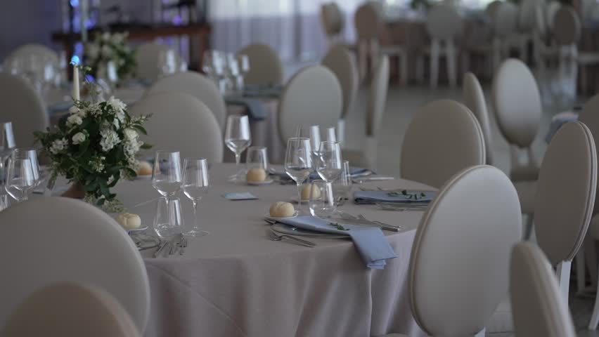 luxury banquet tables decorated with flowers and glassware