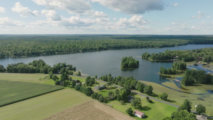 Aerial View Of Pipe Lake Surrounded By Green Lush Nature Scenery In Polk County, Wisconsin, USA.