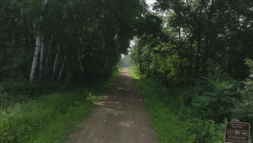 Flying Down The Gandy Dancer State Trail At St. Croix Falls In Wisconsin, United States. Aerial Drone Shot