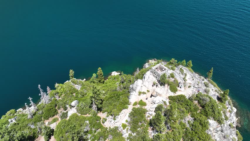 High angle drone shot around the Tea House on Fannette Island in Tahoe, USA