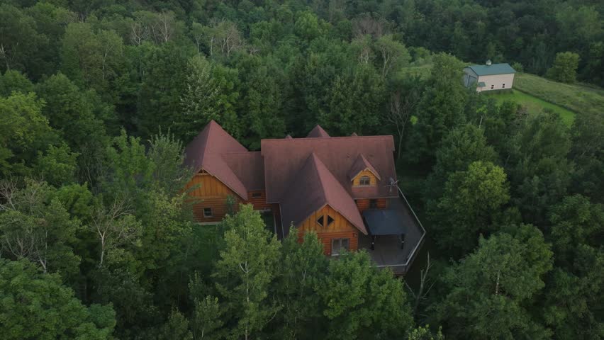 Isolated Wooden Cabin With A Large Deck For Getaway Accommodation At Saint Croix Falls In Polk County, Wisconsin, United States. Aerial Drone Shot