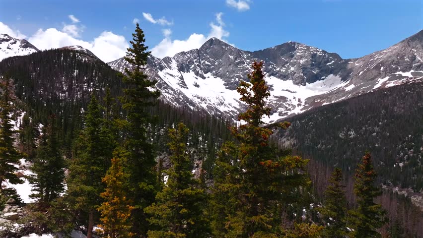 Blanca Peak mount Lindsey Sangre de Cristo Range aerial drone Colorado Rocky Mountains San Isabel National Forest Lily Lake trail sunny spring summer snow fields blue skies clouds morning upwards
