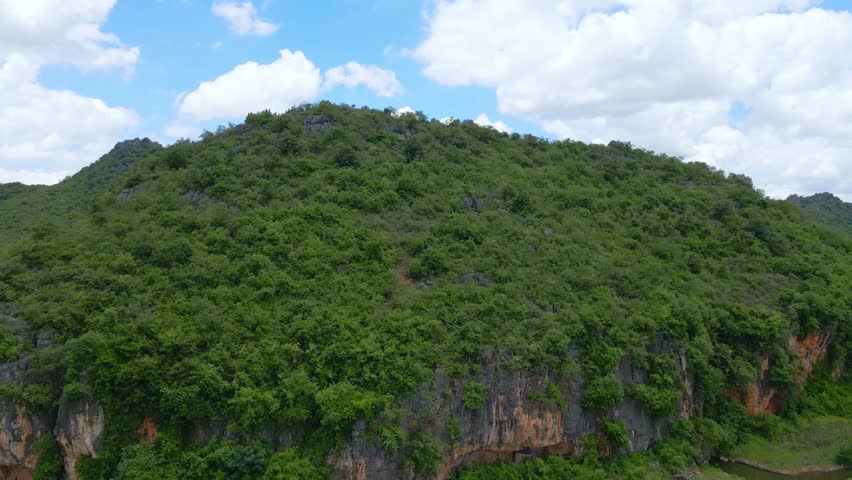 Blue Sky and White Clouds Over Mountain Landscape 4K Real Shot