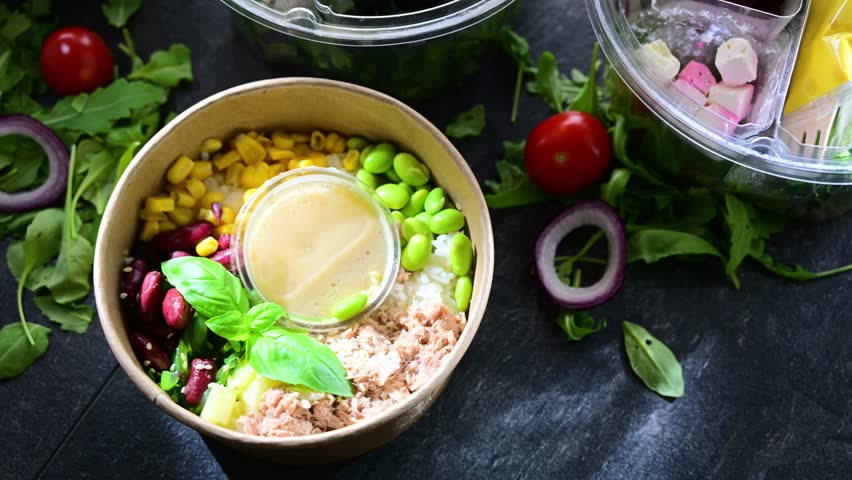 Round plastic boxes with pre-packaged vegetable salads. Convenience food