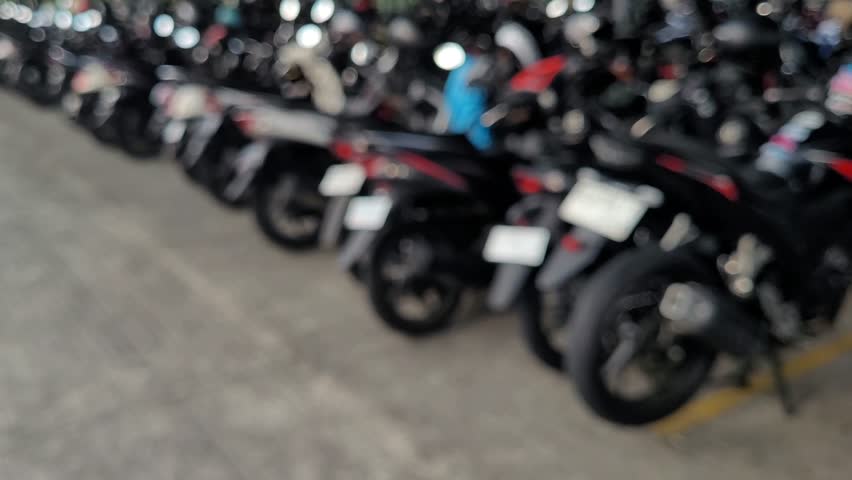 Blurry or defocused image of urban planning parking lot for motorcycle scooter and bike