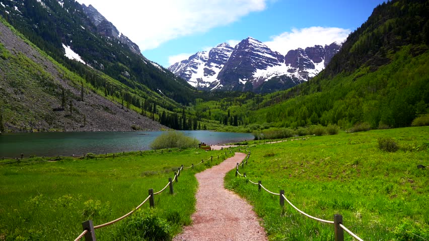 Maroon lake trail Maroon Bells Pyramid Peak 14er Wilderness morning sunny blue sky clouds Aspen Snowmass Colorado Elk Range Rocky Mountains White River National Forest fencing nature scenery static