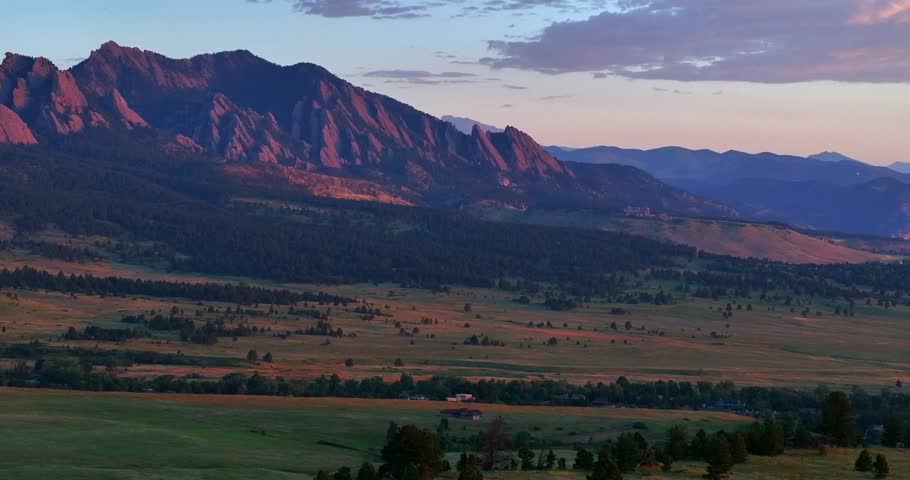 Flatirons Front Range Boulder Chautauqua Park morning sunrise aerial drone Colorado spring summer pink cloud first light on red slanted scenic nature Rocky Mountains parallax circle right