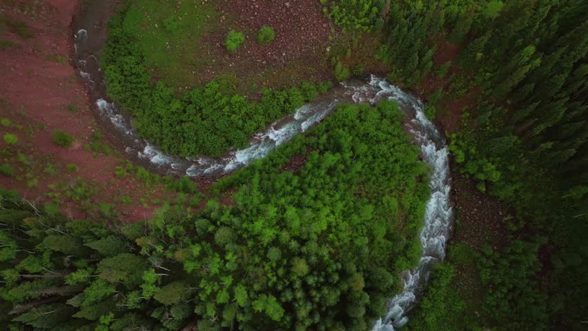 Aspen Snowmass Maroon Creek Roaring Fork Colorado River Maroon Bells Wilderness Rocky Mountains Colorado aerial drone spring summer windy curves White River National Forest afternoon cloudy shade