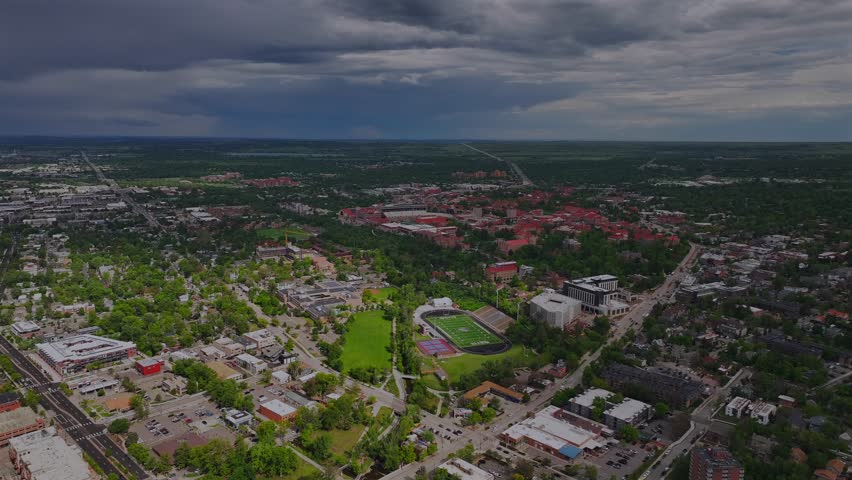 University Boulder Colorado college city town summer spring aerial drone football stadium school Pearl Street Mall Eben G Fine Park Boulder creek Flatirons Green mountain blue sky sunny clouds circle