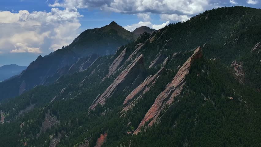 Green Flatirons Mountain Chautauqua Park Boulder Colorado aerial drone spring summer morning blue sky clouds Royal Arch Shanahan Ridge front range Rocky Mountains parallax circle left motion