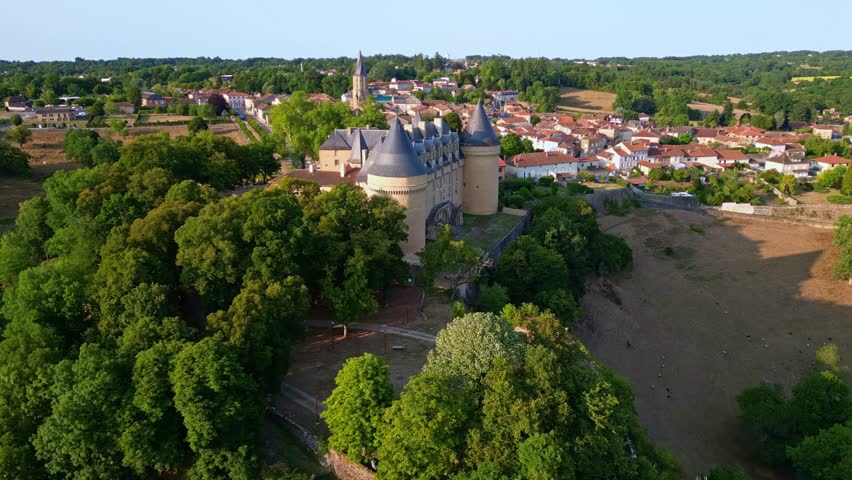 Panoramic drone fly of the front side of the iconic Chateau de Rochechouart castle and museum, Rochechouart, Haute-Vienne, France.