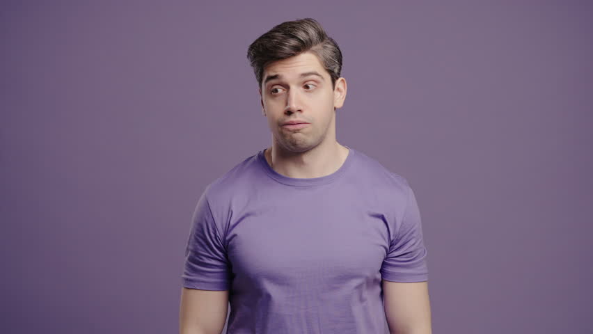 Bored Upset Man Sighs,Rolling Eyes On Violet Backdrop.irritated Dude Displeasure