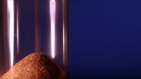 Sand in an hourglass quickly pouring against an animated dark blue background, concept of fast time flow. - Powered by Shutterstock - Get 15% off with code: PIKWIZARD15