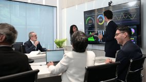 Business team in modern meeting room discussing data analytics on digital screen with charts and graphs, representing teamwork, strategy, innovation, and corporate success. - Powered by Shutterstock - Get 15% off with code: PIKWIZARD15