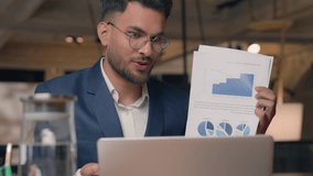 Hindu business man Indian Arabian businessman presenting document video call showing data stats diagram financial sales growth guy male consultant talking discuss conference consultation in office - Powered by Shutterstock - Get 15% off with code: PIKWIZARD15