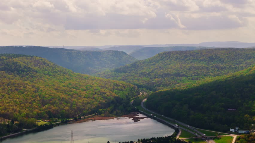 An aerial view of traffic highway near Tennessee River on Marion County Park near Chattanooga on a bright sunny day in Tennessee, USA