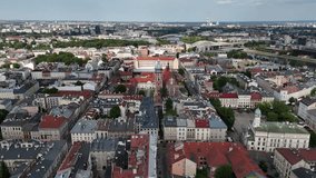 Drone footage of urban architecture with tall buildings, geometric lines, and structural patterns, capturing modern city design, skyline shapes, and architectural rhythm. - Powered by Shutterstock - Get 15% off with code: PIKWIZARD15