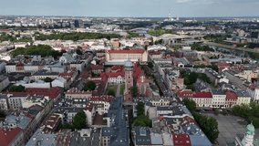 Drone footage of urban architecture with tall buildings, geometric lines, and structural patterns, capturing modern city design, skyline shapes, and architectural rhythm. - Powered by Shutterstock - Get 15% off with code: PIKWIZARD15