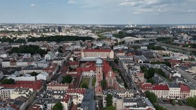 Drone footage of urban architecture with tall buildings, geometric lines, and structural patterns, capturing modern city design, skyline shapes, and architectural rhythm. - Powered by Shutterstock - Get 15% off with code: PIKWIZARD15