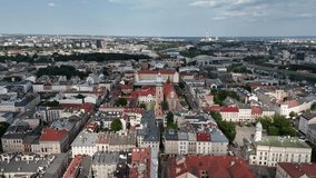 Drone footage of urban architecture with tall buildings, geometric lines, and structural patterns, capturing modern city design, skyline shapes, and architectural rhythm. - Powered by Shutterstock - Get 15% off with code: PIKWIZARD15