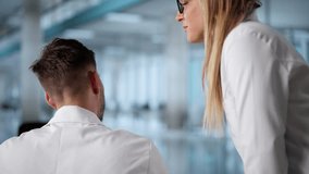 Medical Doctor Staff Gossip. Whispering Into Ear - Powered by Shutterstock - Get 15% off with code: PIKWIZARD15