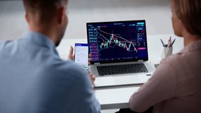 Couple Trading Stock Market Exchange On Laptop - Powered by Shutterstock - Get 15% off with code: PIKWIZARD15
