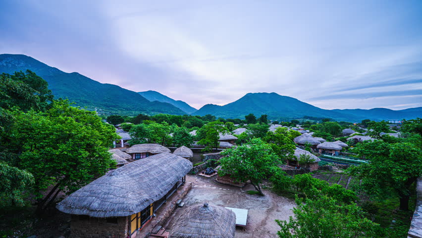 4k time lapse video of morning view of traditional Korean thatched houses at Nakaneupseong Folk Village, Suncheon, Jeollanam-do, South Korea.