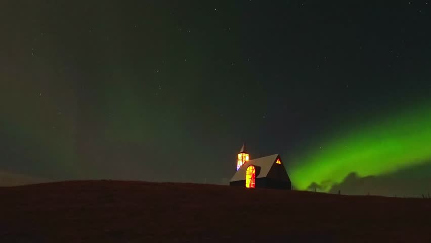 Aurora Borealis over beautiful Icelandic church in Iceland at night