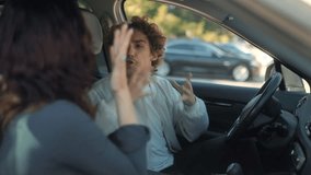 A toxic couple screams at each other inside a vehicle. Both are angry and upset, showing frustration and sadness during a heated emotional confrontation. - Powered by Shutterstock - Get 15% off with code: PIKWIZARD15
