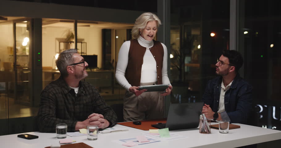 Business people, tablet and planning for schedule, brainstorming or project deadline at night. Group, employees or team working late with technology for creative development or agenda in office