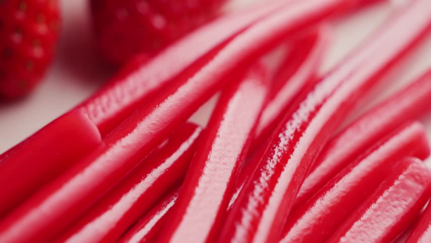 Red licorice candy sticks, sweet candy and snack sugar. High quality 4k footage