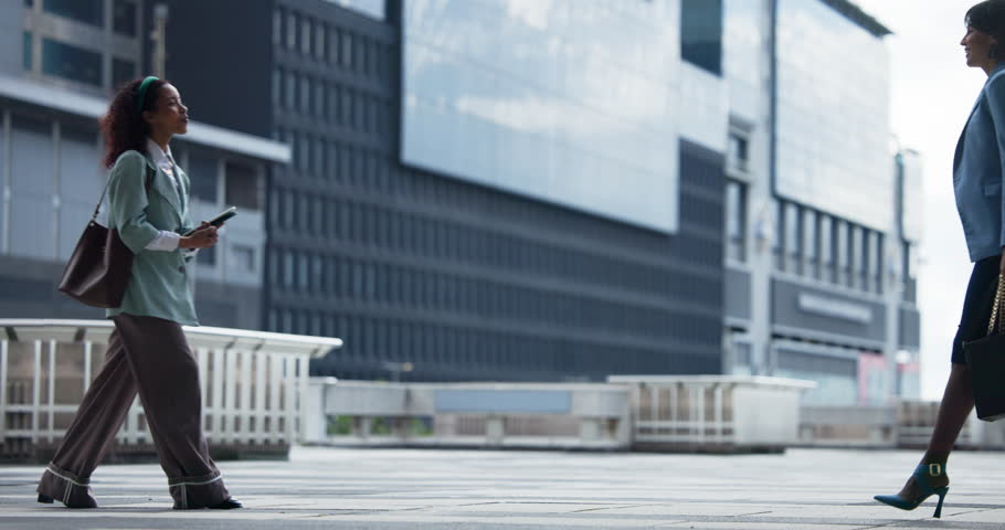 City, walk and business women with handshake for greeting, meeting or real estate partnership. Collaboration, happy worker or shaking hands outdoor for intro, negotiation or property development deal