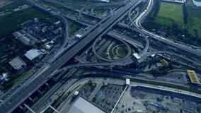 Futuristic aerial view of a multi-level highway interchange merging into a glowing holographic Earth. Flowing traffic, 3D globe, drones, Wi-Fi, and smart city icons visualize AI-driven connectivity. - Powered by Shutterstock - Get 15% off with code: PIKWIZARD15