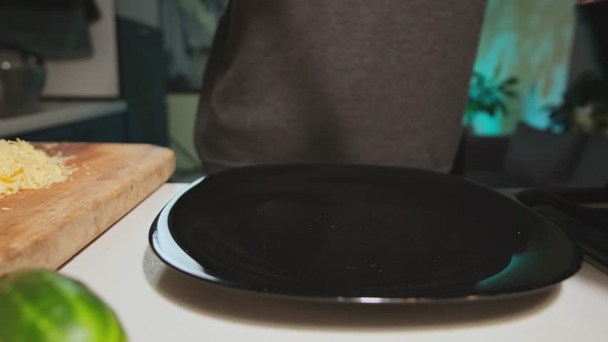 Serving pasta with tomato sauce and grated cheese realistic home cooking scene