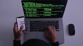 Developer coding on both phone and laptop, multitasking in software development environment. - Powered by Shutterstock - Get 15% off with code: PIKWIZARD15