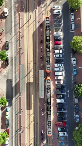 4K drone shot of Alicante TRAM in motion with cityscape background