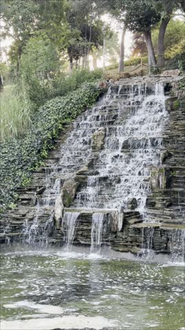Tranquil Waterfall in Scenic Garden Park with Multiple Streams Cascading from Rocky Cliff, Green Moss on Stones, Golden Sunset Light, Autumn Leaves and Lush Trees, Peaceful Nature Soundscape for Relax